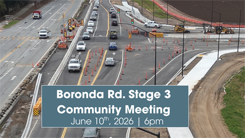 High-angle view of road construction on Boronda Road with orange cones and active traffic. Overlay text at the bottom reads: 