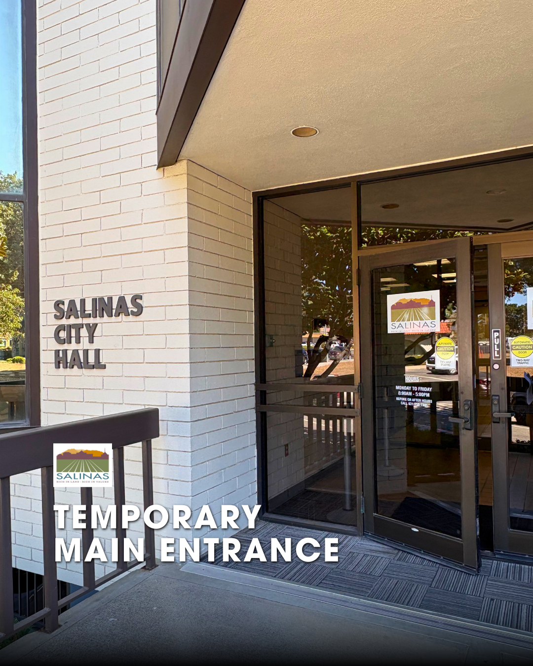 Doors to city hall facing Lincoln st with text 