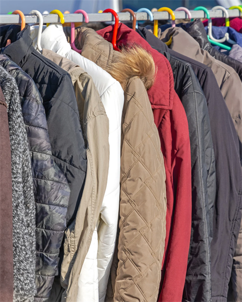 stock image of coats on a rack