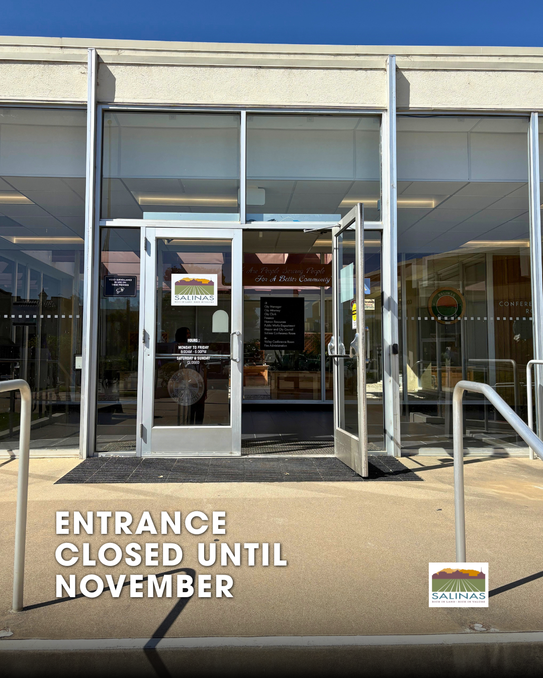 Doors to city hall facing Lincoln st with text 
