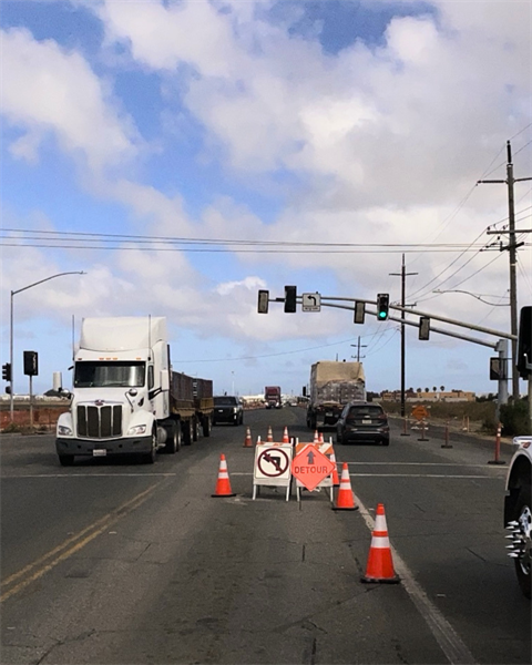 Intersection construction zone with orange cones, a 