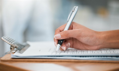 Photo of a woman filling out an application