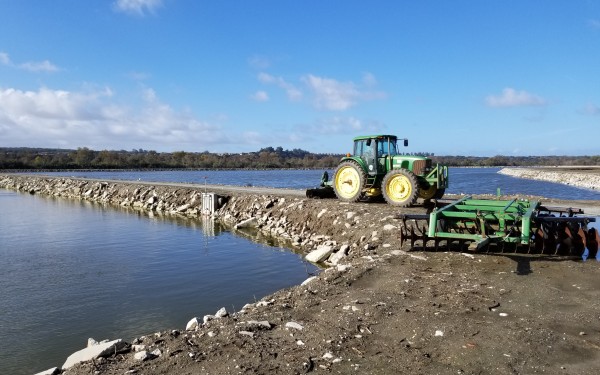 A tractor at a wastewater facility